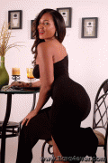 Tiara in a sexy black dress